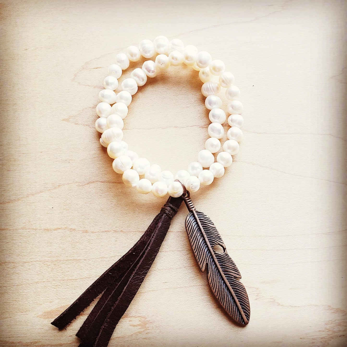 Feather In The Wind Double Strand Pearl Bracet
